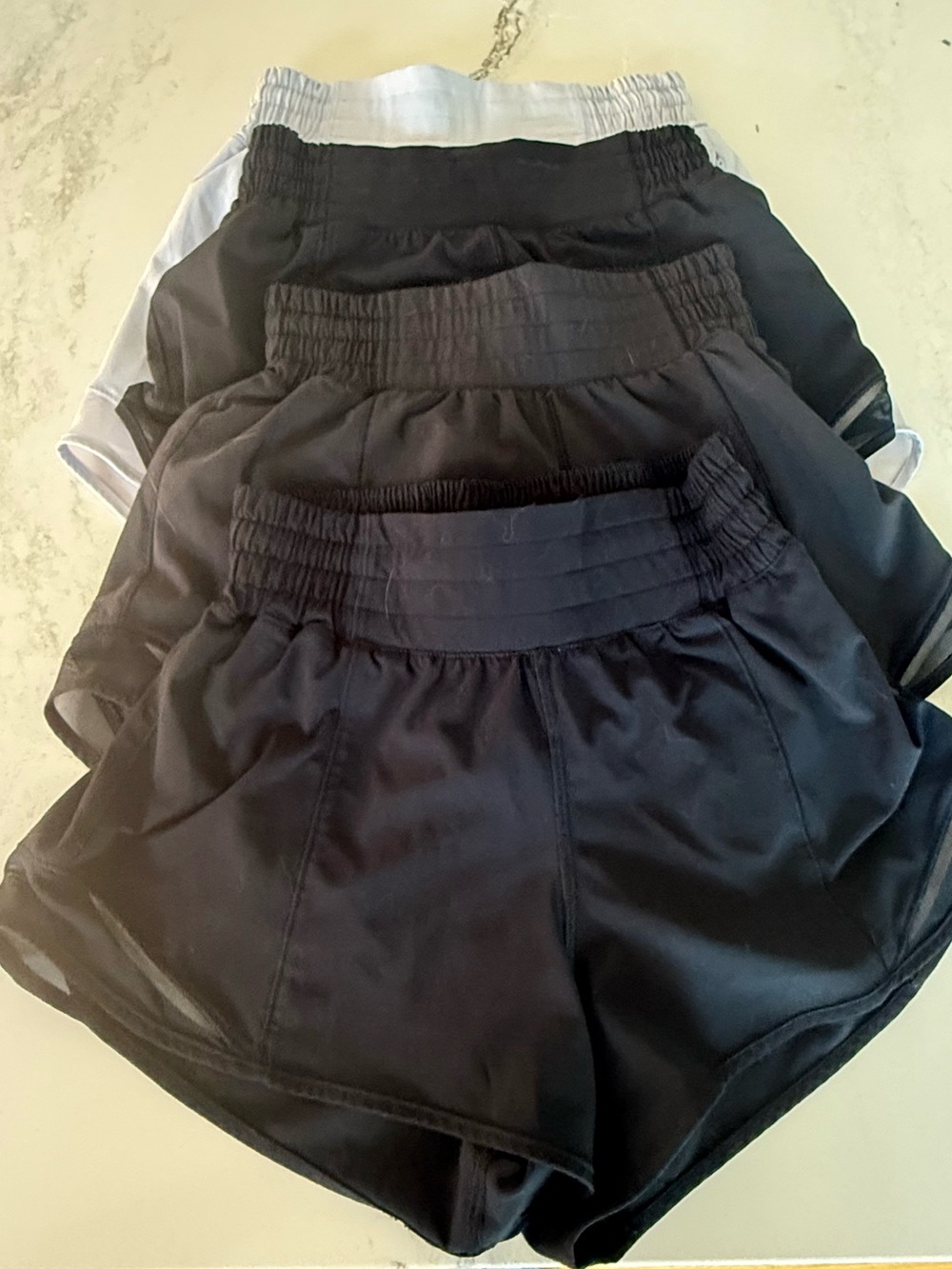 Lululemon Hotty Hot Shorts Size2 Black ones in 2.5” and light blue in 4”